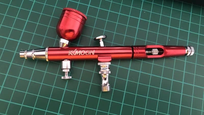 kkmoon airbrush in anodised red on a cutting mat