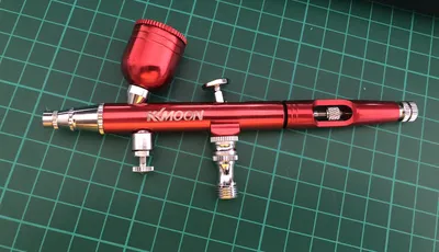 kkmoon airbrush in anodised red on a cutting mat