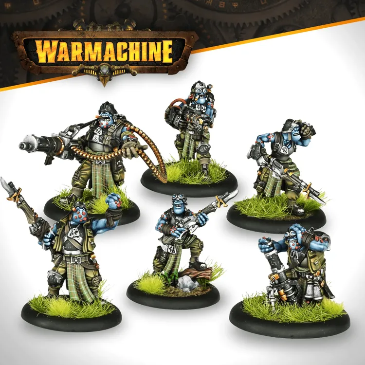 A group of six trollkin miniatures from the Southern Kriels Kithguard army for Warmachine, each displaying distinct poses and weaponry. The figures are predominantly blue-skinned, wearing tactical gear with plaid accents, and are set on circular black bases adorned with green grass. They are equipped with various weapons, including a firearm and a large cannon, showcasing their role as disciplined jungle fighters.