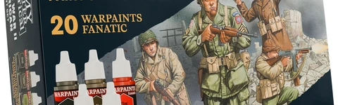 A paint set titled "World War II American Paint Set" features a box design showcasing three American soldiers in historical uniforms, set against a backdrop of crumbling walls. The box includes five paint bottles prominently labeled "WARPAINTS FANATIC," with colors such as "Dark Drab," "Medium Drab," "Paratrooper Tan," "Tang Red," and "Ensign Blue." The text emphasizes "20 WARPAINTS FANATIC" and "AUTHENTIC COLOURS FROM HISTORICAL SOURCES," highlighting the set's focus on historical accuracy.