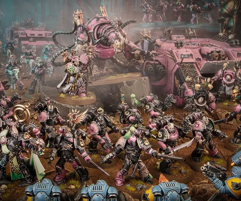 The image features a dynamic scene filled with a multitude of Emperor’s Children miniatures from the Warhammer 40,000 universe, showcasing their vibrant pink and purple color scheme. In the foreground, a diverse array of Chaos Space Marines, adorned with ornate armor and chaotic symbols, engage in battle, while a towering, menacing figure looms behind them, possibly a Daemon Engine or a warlord. Several vehicles, including armored transports, are also present, adding to the chaotic atmosphere of the battlefield, which is set against a dark, atmospheric backdrop. The overall composition emphasizes the flamboyant and hedonistic nature of the Emperor’s Children, reflecting their devotion to Slaanesh.