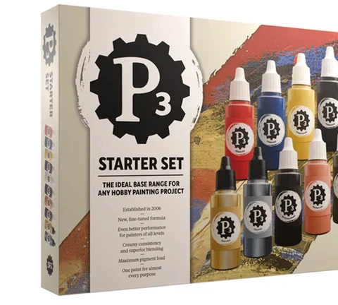 A box for the P3 Starter Set features a bold design with the P3 logo prominently displayed. The packaging showcases ten 18 ml dropper bottles of paint, including eight rich acrylics and two metallics, arranged in a visually appealing manner. Text on the box highlights the set as the ideal base range for hobby painting projects, emphasizing its creamy consistency, superior blending, and maximum pigment load.