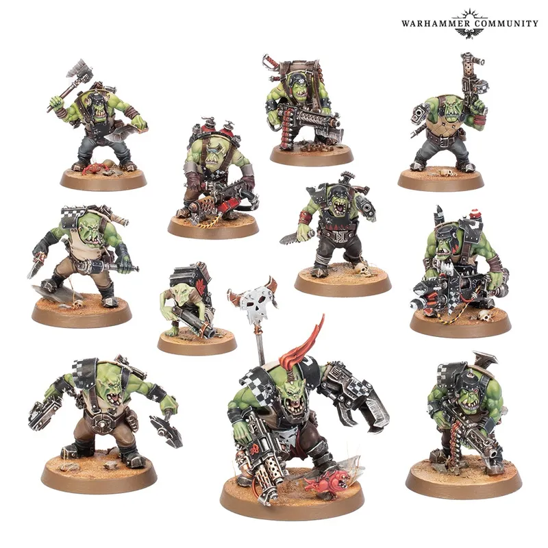 11 green Ork miniatures on round bases, various weapons and armor, "WARHAMMER COMMUNITY" text top right