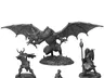 Gray metal miniatures: dragon, warrior, mage, thief on bases.