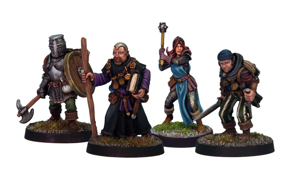 A group of four detailed miniatures representing classic adventurer character classes. On the left, a knight in armor holds a shield, followed by a robed figure with a book and staff. The third figure is a female illusionist in a blue dress with a staff, and on the right, a rugged fighter brandishes a sword. Each miniature is mounted on a round base with grass detailing.