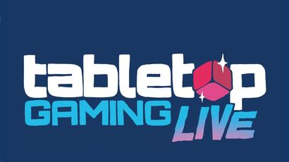The logo for "Tabletop Gaming Live" features bold, playful typography on a dark blue background. The word "tabletop" is in white, while "GAMING" is in a vibrant blue, and "LIVE" is in a gradient of pink to purple, with a stylized red gaming die incorporated into the design. The overall look is dynamic and inviting, reflecting the excitement of the event.