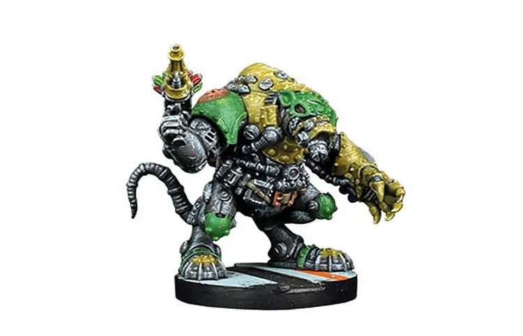 A large, bio-augmented Verr-Myn figure stands in a dynamic pose, showcasing a muscular, rat-like body covered in a mix of green and gray armor. The figure has a prominent, spiked back and a mechanical arm holding a weapon, while its other arm is poised for action. Its feet are large and clawed, and the base features a simple, multi-colored design, suggesting a battlefield setting.
