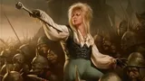 A fantasy card titled "Call Out the Goblins!" under Boggart Shenanigans. A woman with blonde hair, green pants, and a white shirt stands in a battle pose, holding a staff, surrounded by goblins in helmets and armor.
