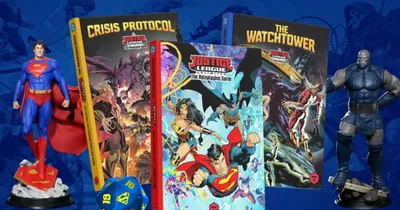 Justice League Unlimited RPG books, Crisis Protocol, The Watchtower, and a blue d20 die.