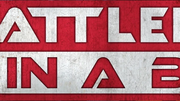 A bold graphic features the text "BATTLEFIELD IN A BOX" prominently displayed in large, stylized letters. The background is a textured red, contrasting with the white and silver elements of the text. The overall design conveys a strong, dynamic feel, suitable for a tabletop gaming context.