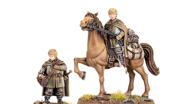 A miniature figure of Lief, a page from Rohan, stands beside a mounted version of himself on a brown horse. The standing figure is dressed in a green and brown cloak, holding a satchel, while the mounted figure wears similar attire and holds the reins of the horse. Both figures are set on a base with tufts of grass and small rocks, emphasizing their connection to the Rohan landscape.