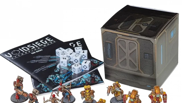 A collection of detailed resin miniatures from the Sythopian Wars starter set titled "VoidSiege" is displayed prominently. The scene includes various character models and units, such as the Asylumist N-Force and the Confederation forces, arranged around two copies of the 28-page rulebook and a set of dice. A box featuring futuristic design elements is also present, adding to the thematic presentation of the game.