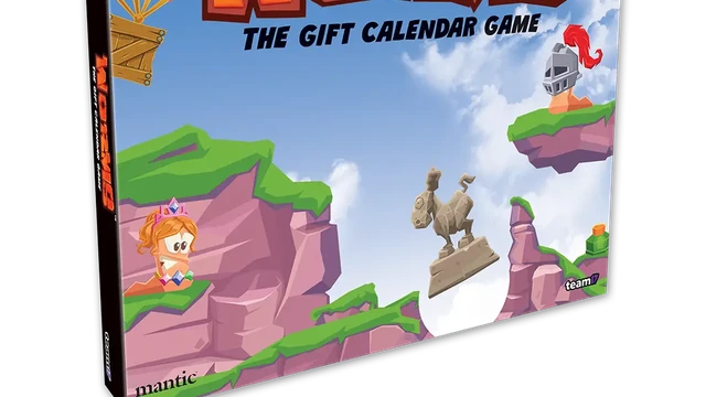 A colorful box for "Worms: The Gift Calendar Game" features a vibrant illustration of cartoonish landscapes with green hills and rocky cliffs. Prominent characters include a pink worm wearing a crown and a knight, both positioned on the cliffs, while a hot air balloon floats in the sky. The title is boldly displayed at the top, emphasizing the festive theme of the advent calendar.