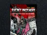 A vibrant comic-style cover for "Secret Passages Issue 2" features a muscular, armored figure with a crown and flowing red cape, standing confidently amidst a gritty, urban backdrop. The character wields a sword and is surrounded by crumbling walls adorned with graffiti, evoking a sense of adventure and nostalgia for classic tabletop gaming. The title is prominently displayed at the top in bold, stylized lettering, with a red and black color scheme enhancing the dramatic atmosphere.