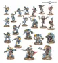 A collection of miniatures features a variety of Grey Wolves and Tyranids, showcasing detailed paintwork and dynamic poses. The Grey Wolves are predominantly clad in blue armor with yellow accents, wielding various weapons such as chainswords and bolters, while some figures display intricate details like fur and armor embellishments. The scene includes a mix of infantry and larger characters, emphasizing the diverse range of units available for players.