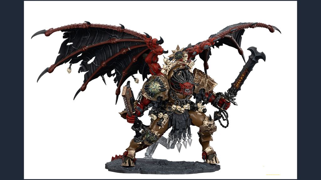 A large, intricately detailed statue of Angron, the Daemon Primarch of Khorne, stands prominently. He features massive, bat-like wings and a fierce expression, with a head that appears relatively small compared to his muscular body. Adorned with skulls and ornate armor, he wields a large sword in one hand and a weapon in the other, standing on a textured base that enhances the dramatic effect of the figure. The color palette includes deep reds, blacks, and metallic tones, emphasizing his menacing presence.