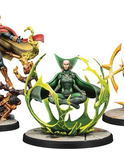 The image features three miniatures from Marvel: Crisis Protocol. On the left, Adam Warlock stands in a dynamic pose, wielding a staff and wearing a red and blue costume with a flowing cape. To the right, Moondragon is depicted seated in a meditative pose, surrounded by a green, swirling energy effect, dressed in a green suit. Both miniatures are mounted on circular bases, with intricate details highlighting their cosmic themes.