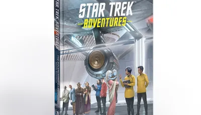 A hardcover book titled "Star Trek Adventures: The Roleplaying Game Species Sourcebook" is prominently displayed, featuring a colorful cover illustration. The scene depicts a diverse group of characters, including various alien species and Starfleet officers, gathered in a futuristic setting resembling a starship interior. The background showcases sleek technology and a large circular device, emphasizing the sci-fi theme of the Star Trek universe.