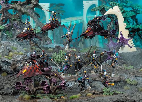 A dynamic scene showcases a group of Harlequin miniatures from Games Workshop, featuring vibrant colors and intricate details. The display includes two Skyweavers and a Starweaver, with Harlequin models in various poses, some wielding weapons and others in dramatic stances. The background features a fantastical landscape with alien flora, enhancing the colorful and theatrical theme of the Harlequins.