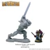 A large, muscular barbarian figure is depicted in a dynamic pose, raising a sword high above his head. The barbarian is unpainted and made of gray resin, showcasing intricate details in his muscular physique and clothing. Next to him, a smaller, painted elven miniature stands with two daggers, providing a sense of scale between the two figures.