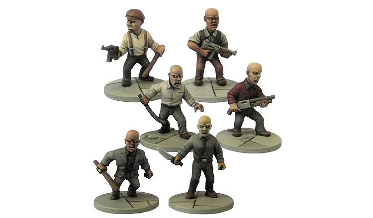 The image features a group of six sci-fi miniatures, depicting bald male characters in various poses. They are dressed in casual clothing, with some holding weapons like guns and a baton, while others have their hands on their hips or are gesturing. The miniatures are painted in muted colors, standing on circular bases with a textured surface, suggesting a gritty, urban environment.