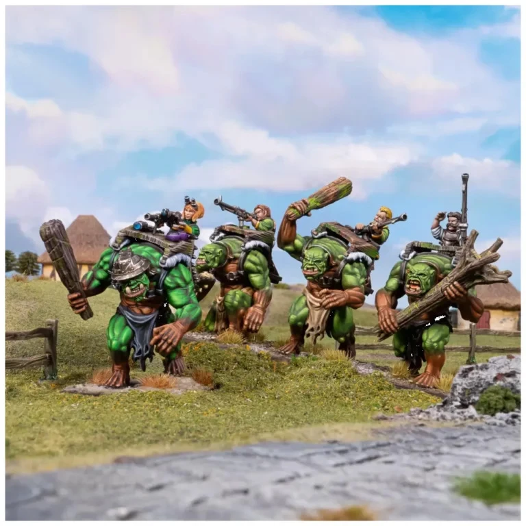 A group of four large, green trolls stands in a grassy landscape, each wielding oversized clubs. One troll carries a halfling on its back, who is holding a trumpet, while another troll has a small gunning platform strapped to its back, manned by a halfling with a gun. The background features a rustic setting with thatched-roof buildings and trees under a blue sky with scattered clouds.