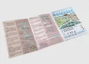 An open game booklet with a map of the Bordeaux wine region on the right page, featuring illustrated vineyards, towns, and a scoring track. The left page contains game rules, sections titled "Gather Resources," "Bases," "Vines," "Trellises," "Pass," and "Game End," along with diagrams of game components like coins, grapes, and barrels. The booklet is placed on a white surface.