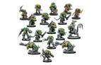 A diverse group of Verr-Myn miniatures is displayed, showcasing various characters from the faction. Prominent figures include heavily armored Stalkers and Runners wielding weapons, alongside smaller Thralls and a formidable Crone Mother with bio-augmented features. The miniatures feature a mix of green and gray colors, with intricate details highlighting their cybernetic enhancements and weaponry, all set against a plain white background.