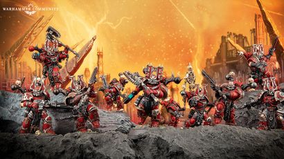 A group of World Eaters miniatures stands prominently against a fiery orange background, depicting a chaotic battlefield. The figures are heavily armored, predominantly in red with black and silver details, showcasing various weapons and intricate designs, including a large, imposing character at the center. The rocky terrain beneath them adds to the dramatic atmosphere, emphasizing their fierce presence in the Warhammer 40k universe.