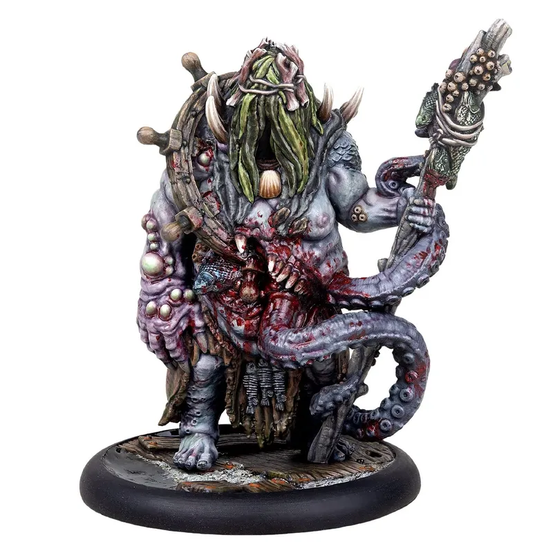 A squid-like miniature holding a staff, on a round base.