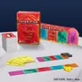 Board game box titled Priorities: A Court of Thorns and Roses, featuring red and gold design. Opened box reveals colorful cards with ACOTAR-themed illustrations, a yellow deck of prompts, and wooden game pieces shaped like a crown and number tokens.