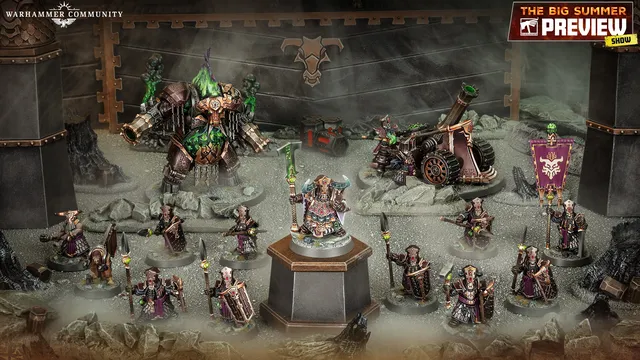 A detailed display of the new Zharrdron army features various miniatures set against a dark, industrial backdrop. In the center, a prominent War Despot stands on a pedestal, clad in imposing armor and wielding a staff, surrounded by Infernal Cohorts holding spears. To the left, a large, menacing Dominator Engine looms, while a mortar-like Tormentor Bombard is positioned on the right, showcasing the army's dark and chaotic aesthetic.