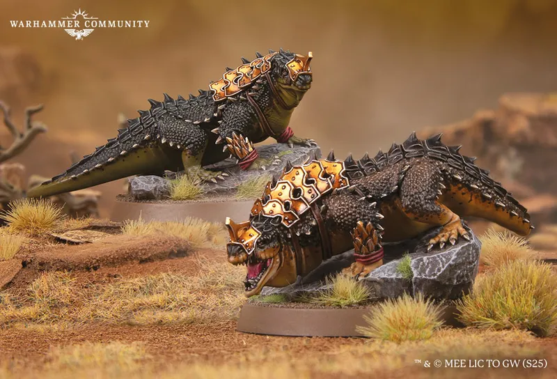 Two fierce war drakes of Rhûn are depicted, showcasing their armored backs adorned with golden spikes and intricate details. The drakes are positioned on rocky terrain with tufts of grass, one drake displaying a menacing expression while the other appears poised and alert. Their scales are a mix of dark green and brown, emphasizing their formidable presence in the Middle-earth setting.