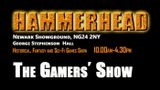 A promotional graphic for the "Hammerhead" tabletop gaming event, featuring bold, textured orange lettering against a black background. The text includes details about the event's location at Newark Showground, the date and time from 10:00 AM to 4:30 PM, and highlights that it focuses on historical, fantasy, and sci-fi games. The phrase "The Gamers' Show" is prominently displayed in white, emphasizing the participatory nature of the event.