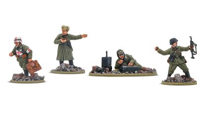 Three 28mm scale miniatures are displayed, featuring a Soviet commander in a long coat gesturing, a soldier crouched beside a radio, and another soldier lying on the ground, focused on a device. The miniatures are set on bases with rocky terrain, showcasing detailed sculpting and paintwork. Each figure represents different roles within a military context, emphasizing their unique poses and equipment.