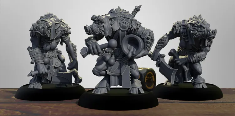 Three intricately designed miniature figures of pig-like warriors stand prominently on a dark circular base. Each figure is heavily armored, adorned with various accessories and weapons, including a sword and a large circular object, suggesting a battle-ready stance. The miniatures are rendered in a gray color, showcasing detailed textures and features, such as fur and armor plating, against a simple wooden surface.