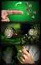 A collection of fantasy-themed rings is displayed, featuring intricate designs and a hidden compartment for miniature RPG dice. The top section shows a hand with a finger pointing upwards, with several polyhedral dice floating above it against a green background. The middle section highlights a detailed ring with a sculpted design, resting on a textured surface, while the bottom section features a hand wearing a different ring, showcasing its ornate details alongside more miniature dice.