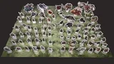 Cardboard standees of fantasy characters and creatures on a green grid map.