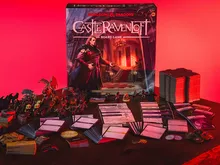 Castle Ravenloft Board Game box, miniatures, cards, and tokens on a table.