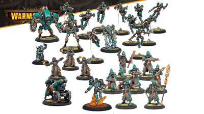 A diverse array of miniatures from the Crucible Guard expansion for Warmachine is displayed, featuring a mix of infantry and warjacks. The models are predominantly teal and brown, showcasing various characters including a heavy warjack, infantry soldiers, and combat alchemists, all set on circular bases with grassy textures. Notable elements include a warjack with a large cannon, soldiers wielding grenades, and a figure emitting flames, highlighting the faction's unique combat style and thematic elements.