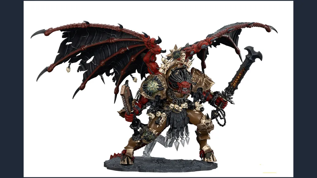 A large, intricately detailed statue of Angron, the Daemon Primarch of Khorne, stands prominently. He features massive, bat-like wings and a fierce expression, with a head that appears relatively small compared to his muscular body. Adorned with skulls and ornate armor, he wields a large sword in one hand and a weapon in the other, standing on a textured base that enhances the dramatic effect of the figure. The color palette includes deep reds, blacks, and metallic tones, emphasizing his menacing presence.
