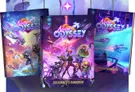 Three vibrant books titled "Neon Odyssey," "Cosmic Codex," and "Overdrive Expansion" are prominently displayed, showcasing colorful artwork that reflects a sci-fi theme. The covers feature a diverse group of characters, including a humanoid figure with a futuristic weapon, a robotic character, and others in dynamic poses, set against a cosmic backdrop filled with stars and spaceships. The title "Neon Odyssey" is prominently featured at the top of each book, emphasizing the game's space opera theme.