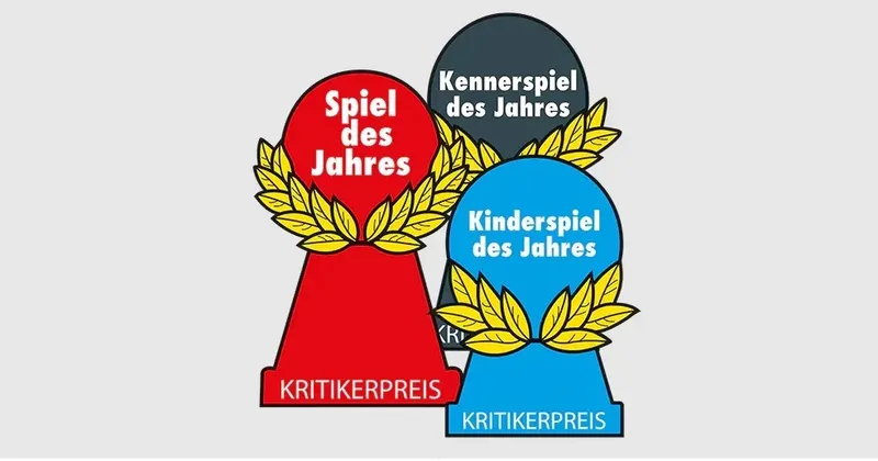 Three pawn-shaped awards with laurel wreaths. The red award reads "Spiel des Jahres" and "KRITIKERPREIS". The dark gray award reads "Kennerspiel des Jahres". The blue award reads "Kinderspiel des Jahres" and "KRITIKERPREIS".