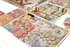 Colorful board game with chess-themed illustrations, tokens, and player pieces.