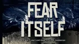 Dark, shadowy figure in hooded coat stands near a cracked wall. A skull with glowing eyes looms in the background. Text reads: "FEAR ITSELF" in bold white letters, with smaller text below: "ROBIN D LAWS AND GARETH RYDER-HANRAHAN." Scattered bats fly around.