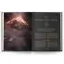Open book with space scene on left page, text on right page titled "THE FRACTURED LIBRARY".