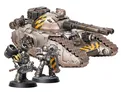 A detailed image features a large, imposing Fellblade super-heavy tank, showcasing a metallic finish with yellow hazard stripes on its turret. Flanking the tank are two MkII Assault Marines, one wielding an axe and the other holding a bolter, both adorned in similar black and yellow armor. The base of the miniatures is textured, enhancing the overall presentation of this Warhammer 40,000 scene.