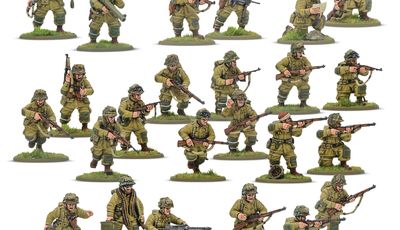 A collection of multi-part plastic miniatures representing US Airborne soldiers in early war, reinforced M42 jump uniforms. The figures are posed in various action stances, showcasing a range of weapons including rifles, submachine guns, and a bazooka, along with additional gear like magazine pouches and a signal lamp. The miniatures are set on grassy bases, highlighting their detailed sculpting and variety within the thirty-man platoon.