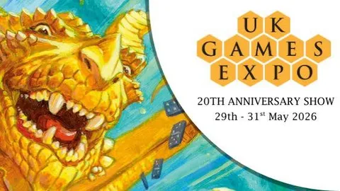 A vibrant illustration features a large, golden dragon with a playful expression, showcasing its sharp teeth and prominent features. The dragon is surrounded by a blue background with scattered game dice, emphasizing a whimsical and dynamic atmosphere. The UK Games Expo logo is prominently displayed in the corner, indicating the event's 20th anniversary from May 29th to 31st, 2026.