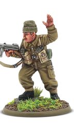 A detailed miniature of a soldier in a military uniform, standing on a circular base adorned with grass and dirt. The figure, representing Augustus Newman VC, is depicted in a dynamic pose, holding a submachine gun in one hand while raising the other in a commanding gesture. He wears a green beret and a khaki uniform, complete with various pouches and gear attached to his chest.
